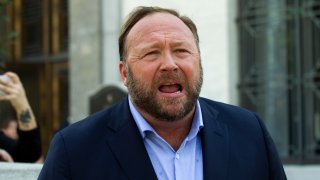 Alex Jones speaks to reporters