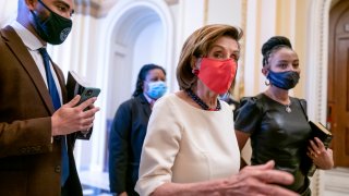 Speaker of the House Nancy Pelosi, D-Calif., center, walks with newly-elected Rep. Shontel Brown, D-Ohio, right, at the Capitol in Washington, Thursday, Nov. 4, 2021. Brown, 46, won the Cleveland-area House seat formerly held by Marcia Fudge, who left to become secretary of the Department of Housing and Urban Development in the Biden administration.