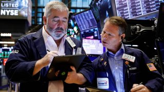 Traders work on the floor of the New York Stock Exchange (NYSE) in New York City, December 8, 2021.