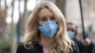 Elizabeth Holmes, founder of Theranos Inc., leaves federal court in San Jose, California, on Wednesday, Dec. 8, 2021.
