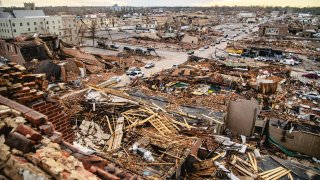 Damaged buildings are seen overhead following a tornado in Mayfield, Kentucky, U.S., on Saturday, Dec. 11, 2021.