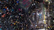 A crowd gathers at the spot where George Floyd was murdered at George Floyd Square after former Minneapolis police Officer Derek Chauvin was convicted of murder and manslaughter of Floyd, April 20, 2021, in Minneapolis.