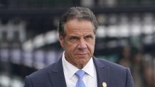 Former New York Gov. Andrew Cuomo prepares to board a helicopter after announcing his resignation, Aug. 10, 2021, in New York. The three-term Democratic governor stepped down in favor of his lieutenant governor, Kathy Hochul, as momentum built in the Legislature to remove him by impeachment.