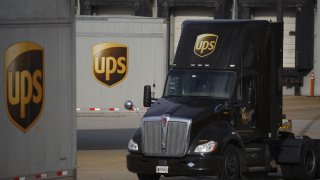 In this file photo, a UPS logo is displayed on a United Parcel Service Inc.