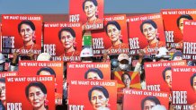 A group of protesting engineers hold up signs calling for the release of detained Myanmar civilian leader Aung San Suu Kyi during a rally against the country's military coup, Naypyidaw, Myanmar, Feb. 15, 2021.