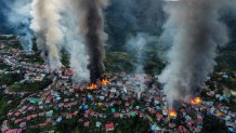 Smoke and fires erupt around Thantlang, in Chin State, Myanmar, Oct. 29, 2021. More than 160 buildings have been destroyed caused by shelling from Junta military troops, according to local media.