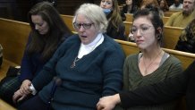 From left: Kariann Swart, Joseph Rosenbaum's fiancee; Susan Hughes, Anthony Huber's great aunt; and Hannah Gittings, Anthony Huber's girlfriend, listen as Kyle Rittenhouse is found not guilty at the Kenosha County Courthouse on Nov. 19, 2021 in Kenosha, Wisconsin.