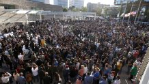 Mourners fill the plaza at San Jose City Hall during a vigil for the nine Santa Clara Valley Transportation Authority light rail yard shooting victims on May 27, 2021, in San Jose, California. Hundreds attended a vigil for the nine people were killed when a VTA employee opened fire at the VTA light rail yard during a shift change on Wednesday morning.