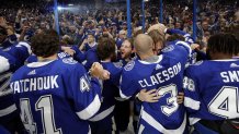The Tampa Bay Lightning celebrate after defeating the Montreal Canadiens 1-0 in Game Five to win the 2021 NHL Stanley Cup Final at Amalie Arena on July 7, 2021 in Tampa, Florida.