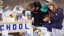 A memorial outside of Oxford High School continues to grow on Dec. 3 2021 in Oxford, Michigan. Four students were killed and seven others injured on November 30, when a student opened fire with a pistol at the school. Both the gunman and his parents were arrested and charged for the shooting.