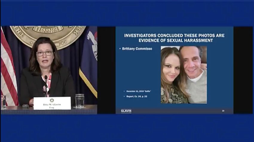 FILE – In this image taken from video made available by the Office of the Governor of New York, Rita Glavin, attorney for Gov. Andrew Cuomo, speaks in Albany, N.Y., on Tuesday, Aug. 10, 2021, with a photo of Brittany Commisso, an executive assistant on Cuomo’s staff. Cuomo will be required to appear virtually for a court session Friday, Jan. 7, 2022, as a judge considers a prosecutor’s request to dismiss Commisso’s fondling case against him because it doesn’t meet the burden of proof. (Office of the Governor of New York via AP, File)