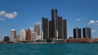 The Detroit skyline is shown from the Detroit River