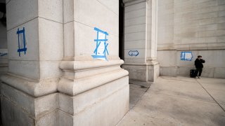 Dozens of swastikas and anti-Obama slogans were drawn on pillars around the exterior of Union Station Friday