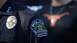 FILE - Members of the Austin Police Department march with protesters from the University of Texas to the State Capitol in Austin, Texas, on June 4, 2020.