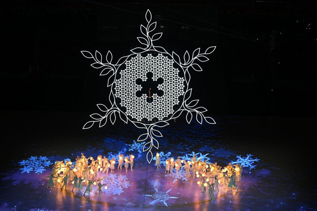 Children carrying snowflake lanterns gather under the snowflake cauldron during the closing ceremony of the Beijing 2022 Winter Olympic Games, at the National Stadium, known as the Bird's Nest, in Beijing, on Feb. 20, 2022.