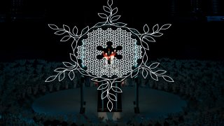 Olympians Dinigeer Yilamujiang and Zhao Jiawen light the Olympic Cauldron during the Opening Ceremony of the Beijing 2022 Winter Olympics at the Beijing National Stadium on Feb. 4, 2022, in Beijing, China.