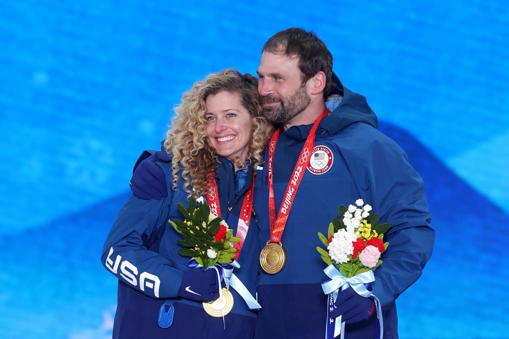 Gold medallists Lindsey Jacobellis and Nick Baumgartner of Team United States pose with their medals during the Mixed Team Snowboard Cross medal ceremony at the 2022 Winter Olympic Games, Feb. 12, 2022, in Zhangjiakou, China.