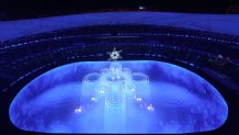 The Olympic Cauldron is seen inside of the Beijing National Stadium as performers dance during the 2022 Winter Olympics Closing Ceremony, Feb. 20, 2022, in Beijing.