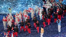 Members of Team Canada make their way into the Beijing National Stadium during the 2022 Winter Olympics Closing Ceremony, Feb. 20, 2022, in Beijing.