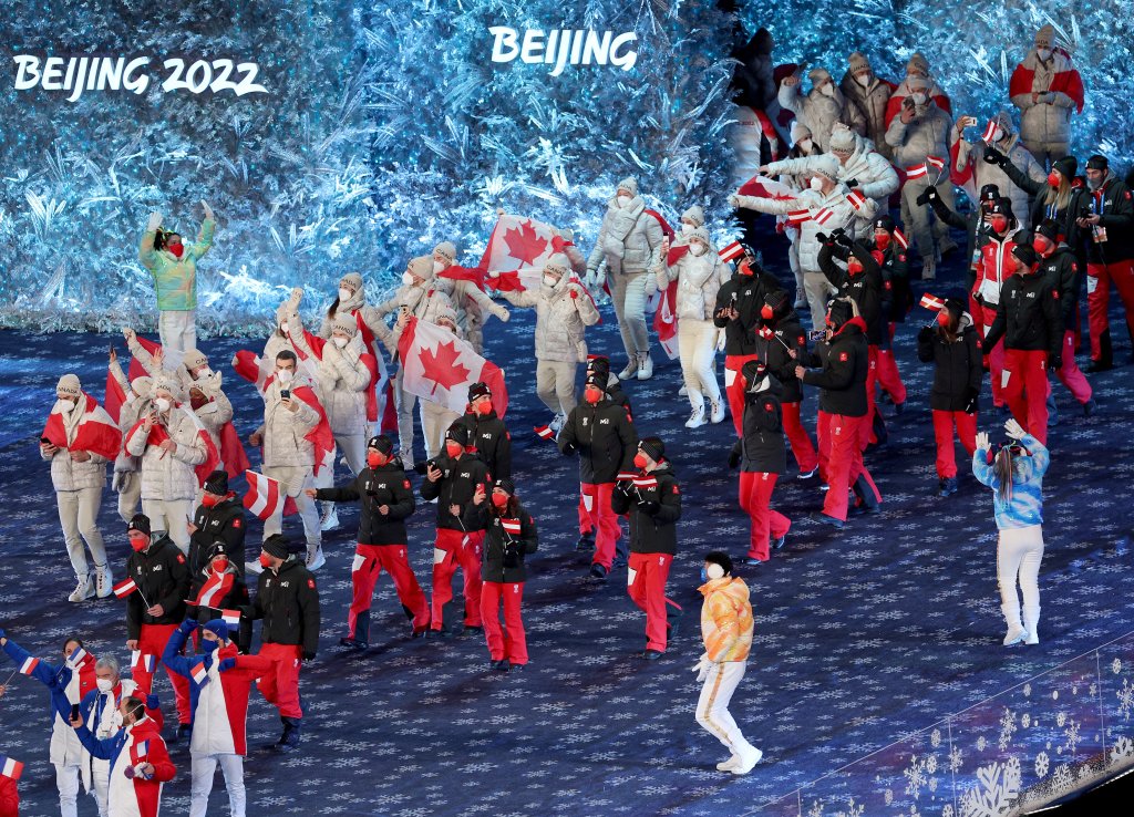 Members of Team Canada make their way into the Beijing National Stadium during the 2022 Winter Olympics Closing Ceremony, Feb. 20, 2022, in Beijing.
