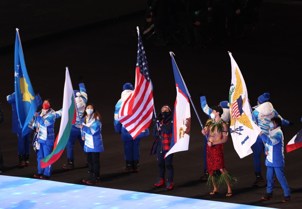 Flag bearer Nathan Crumpton of Team American Samoa (second right) walks in the Athletes Parade during the Beijing 2022 Winter Olympics Closing Ceremony on Day 16 of the Beijing 2022 Winter Olympics at Beijing National Stadium on Feb. 20, 2022 in Beijing.
