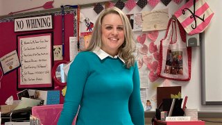 Katie Peters, an English teacher at Whitmer High School, poses in her classroom on Feb. 7, 2022, in Toledo, Ohio.