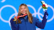 Gold medalist Chloe Kim of Team USA celebrates with their medal during the women's snowboard halfpipe medal ceremony