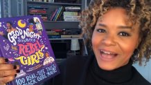 tracee wilkins holding black girl magic book