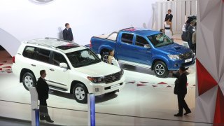 Toyota Land Cruiser 200 sports utility vehicle (SUV) and a Toyota Hilux pickup truck