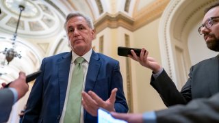 FILE – House Minority Leader Kevin McCarthy, R-Calif., talks to reporters at the Capitol in Washington, April 6, 2022. McCarthy is downplaying secretly recorded remarks he made about Donald Trump shortly after last year’s attack on the Capitol. He also says he never told the then-president that he should resign — something that has not been reported.