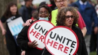 Senate cafeteria workers and union members from UNITE HERE Local 23 and 25 demonstrate outside Senate office buildings, April 6, 2022, in Washington, D.C.