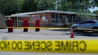 Crime scene tape surrounds Robb Elementary School
