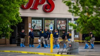 FBI Investigators enter the Tops supermarket in Buffalo, N.Y. on Monday, May 16 2022.