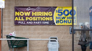 "Now Hiring" sign