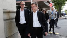 Megaupload executives Mathias Ortmann (2nd L) and Bram van der Kolk (L)