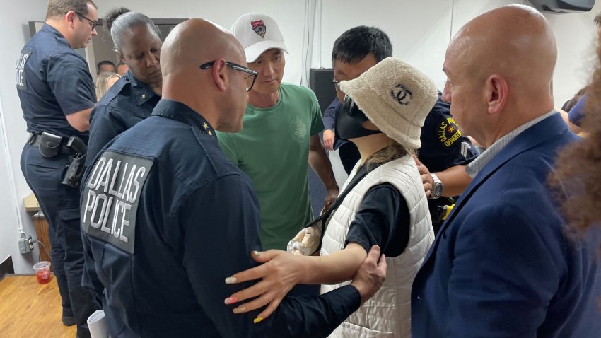 Dallas Police Chief Eddie Garcia meets with one of the unnamed victims in shooting from May 11, 2022. The woman, speaking in Korean, said she was shot in the arm, is recovering and feels better about where things are going after all she's endured.