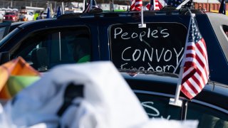 American flags on a vehicle during “The People’s Convoy” event in Hagerstown, Maryland, U.S., on Friday, March 11, 2022. Photographer: Eric Lee/Bloomberg via Getty Images