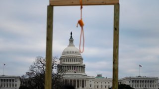 A noose is seen on makeshift gallows as supporters of US President Donald Trump gather on the West side of the US Capitol in Washington DC on January 6, 2021.