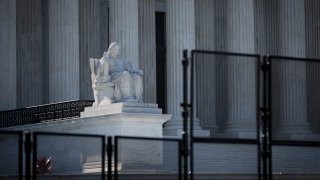 A view of the U.S. Supreme Court through security fencing on June 1, 2022 in Washington, DC.