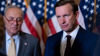 Sen. Chris Murphy, D-Conn., who has led the Democrats in bipartisan Senate talks to rein in gun violence, is introduced by Senate Majority Leader Chuck Schumer, D-N.Y., left, to speak to reporters at the Capitol in Washington, Tuesday, June 14, 2022.