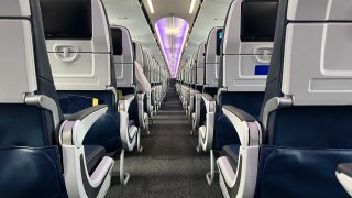 View of economy seats inside the coach cabin of airplane