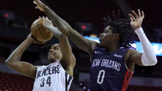Jabari Walker #34 of the Portland Trail Blazers drives to the basket against Dereon Seabron #0 of the New Orleans Pelicans during the 2022 NBA Summer League at the Thomas & Mack Center on July 09, 2022 in Las Vegas, Nevada.