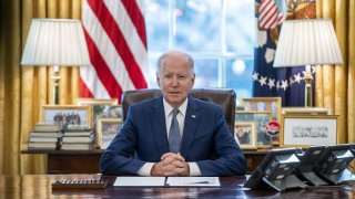 U.S. President Joe Biden speaks before signing an executive order on delivering government services in the Oval Office of the White House in Washington, D.C., U.S., on Monday, Dec. 13, 2021. Biden signed the executive order that seeks to reduce bureaucratic hurdles for Americans seeking government benefits such as Social Security, student loan relief and disaster aid.
