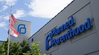 FILE - Missouri and American flags fly outside Planned Parenthood June 24, 2022,