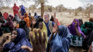 World Food Program chief David Beasley meets with villagers in the village of Wagalla in northern Kenya Friday, Aug. 19, 2022.