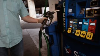 A bus driver fills up at a gas station in Brooklyn on August 11, 2022 in New York City.