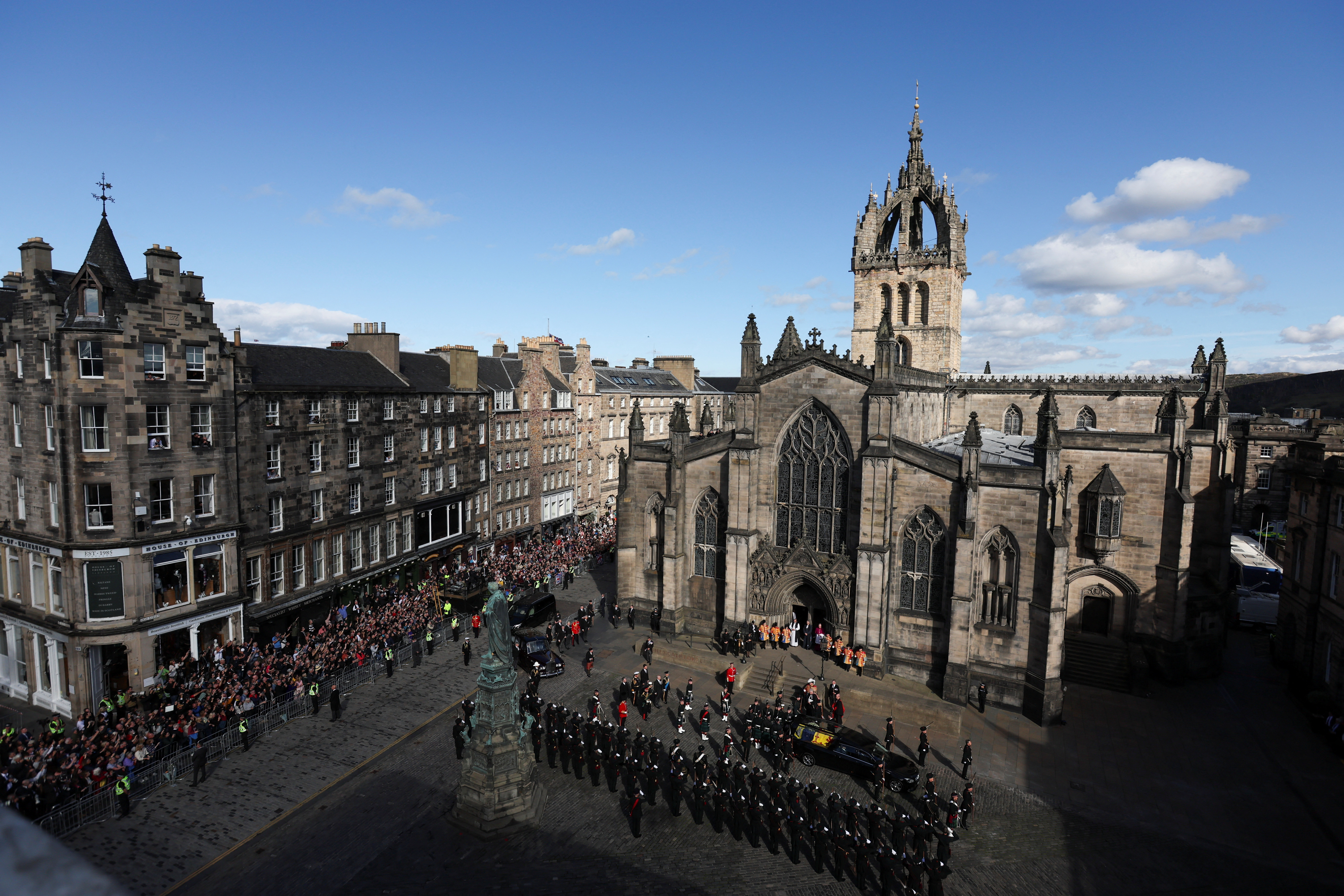 Vice Admiral Timothy Laurence, King Charles III, Princess Anne, Princess Royal, Prince Andrew, Duke of York and Prince Edward, Earl of Wessex, stand as the hearse carrying the coffin of Britain’s Queen Elizabeth II arrives at St. Giles’ Cathedral after the procession from the Palace of Holyroodhouse, Sept. 12, 2022, in Edinburgh, Scotland.