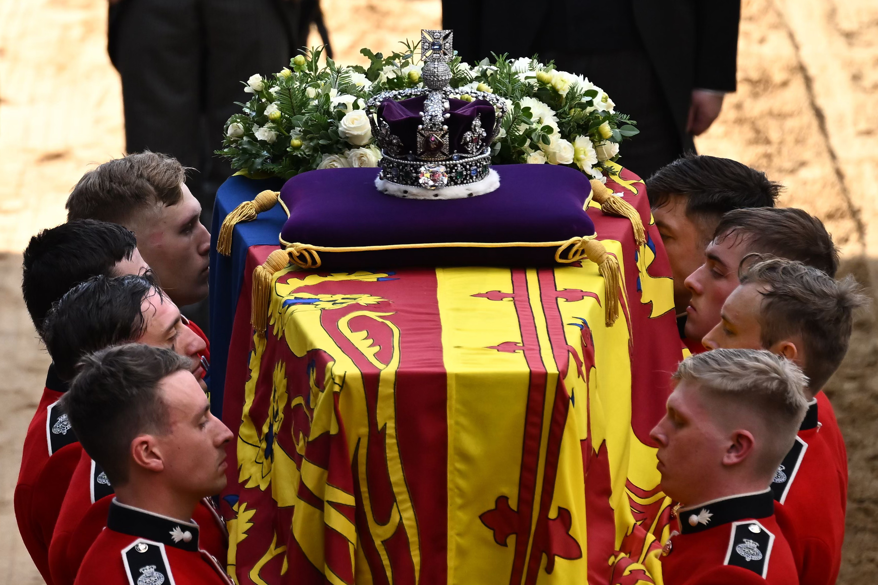 Pallbearers from The Queen’s Company, 1st Battalion Grenadier Guards prepare to carry the coffin of Queen Elizabeth II into Westminster Hall on Sept. 14, 2022 in London.