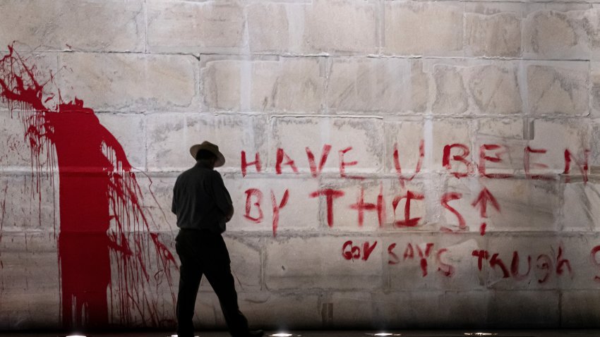 WASHINGTON, DC – SEPTEMBER 21: (EDITOR’S NOTE: Image contains profanity.) The U.S. Park Police guard the Washington Monument after a vandal wrote graffiti and threw red paint against the base of the structure on September 21, 2022 in Washington, DC. A spokesman for the U.S. Park Police said one man was in custody in connection to the incident. (Photo by Nathan Howard/Getty Images)