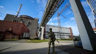 A Russian serviceman guards in an area of the Zaporizhzhia Nuclear Power Station in territory under Russian military control
